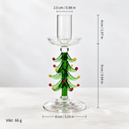 En dekorativ ljushållare i glas med en stiliserad trädform . ljusstakar jul , ljusstakar glas, Julgran form